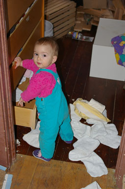 Sungiva explores the contents of her changing table.