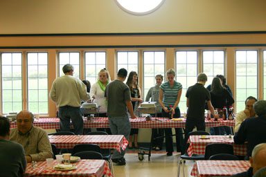Volunteers serve a pancake breakfast at Holy Cross Church.