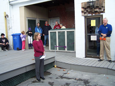 Cafe board president Beth Peck speaks about the ramp.