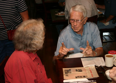 A. K. Fletcher talking with Elsie Gutchess