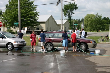 Washing cars and grilling hot dogs