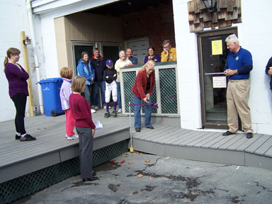 Town Supervisor Sumner cuts the ribbon to open the ramp.