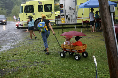 Escaping the rain at the Ellis Hollow Fair.