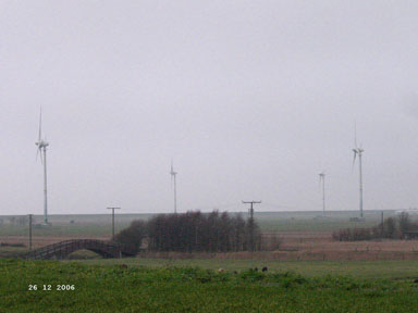 Smaller windmills near the North Sea.