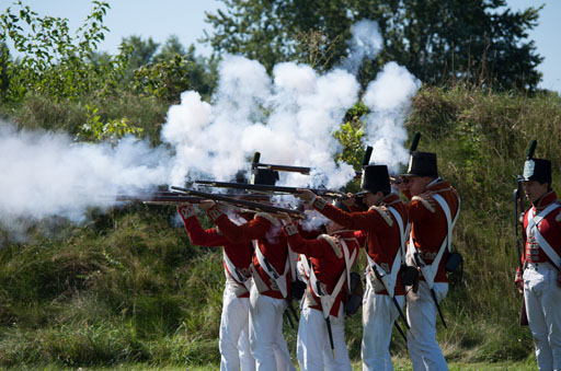 Redcoats firing a musket volley.