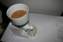 Family Grain Mill grinding flour from wheat