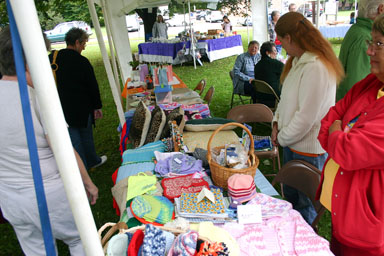 Busy crafts table at Freeville Harvest Festival.