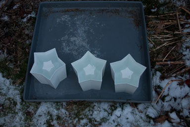 Making lanterns - molds filled with water, left out to freeze.
