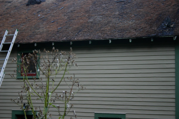 Cedar shingles, exposed for the first time in a long while.
