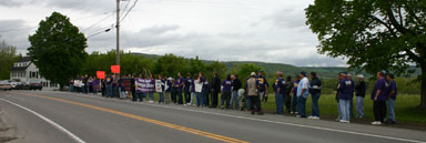 A long line of people along the road.