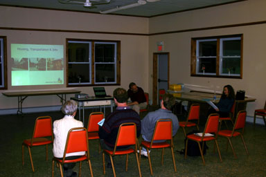 Attendees listen to Heather Filiberto describe the upcoming county plan