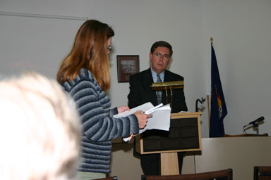 Karen Fuller reads her daughter's writing to Senator Seward