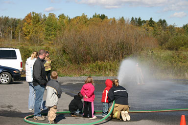 Spraying water from a fire hose