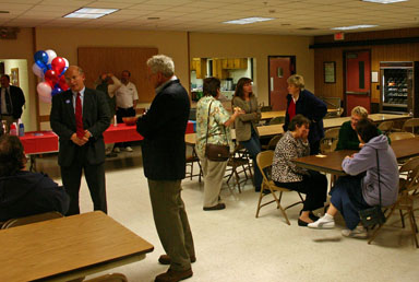 County Legislature candidate Mike Hattery listens to District Attorney Dentes