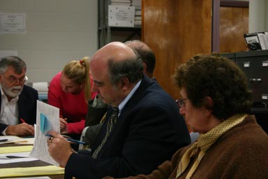 Mike Lane inspects an affidavit ballot
