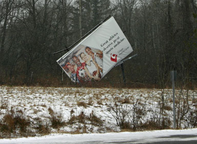 Blown-over billboard along Route 13