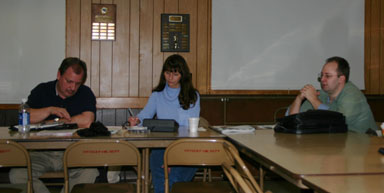 Chris Michaels discusses budgeting issues while Steve Stelick and <span class=