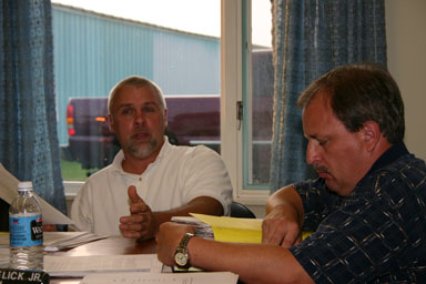 Marty Christofferson reads the county's concerns into the minutes