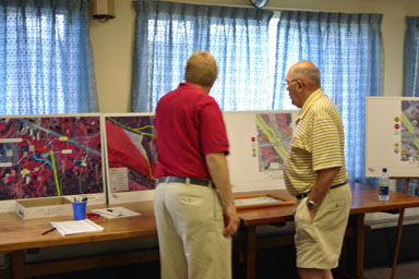 Former Supervisor Clint Cotterill looks over trail plans