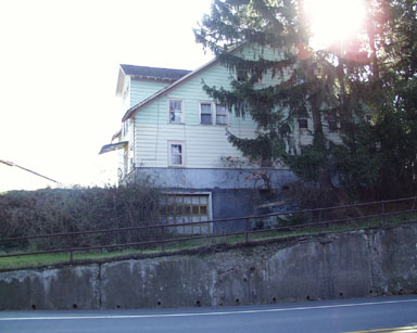 Unnumbered house next to Embassy Inn