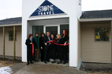 Ribbon cutting at Stone Travel.